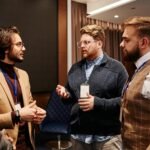 A diverse group of professionals engaged in a business meeting discussion indoors.